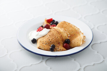 Homemade crepes with berries