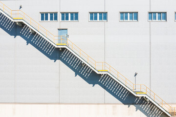 Industrial Staircase with Geometric Shadows on Building