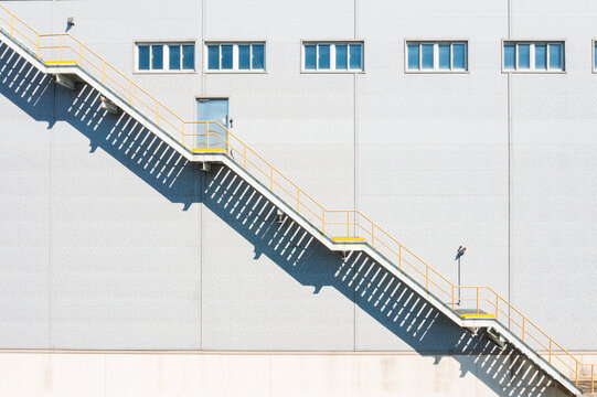 Industrial Staircase with Geometric Shadows on Building