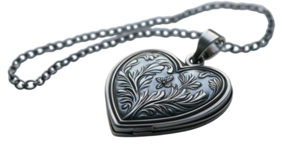Heart-shaped locket with intricate engraving and delicate chain creates timeless elegance