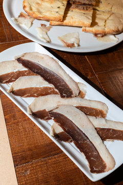 Aged Black Angus Beef Fat Slices on a White Plate