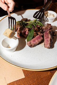 Sliced Ribeye Steak with Smoked Butter and Herbs