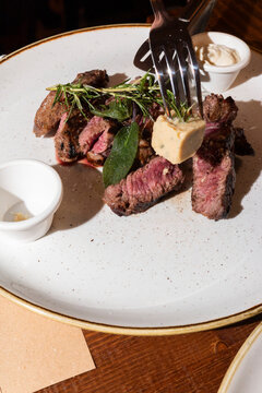 Sliced Ribeye Steak with Smoked Butter and Herbs
