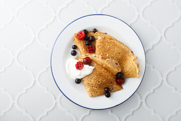 Homemade crepes with berries