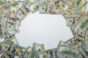 Stacks of hundred dollar bills arranged creatively on a flat surface for financial themes and...