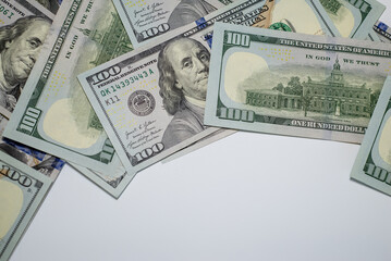 Stacks of hundred dollar bills arranged creatively on a flat surface for financial themes and marketing