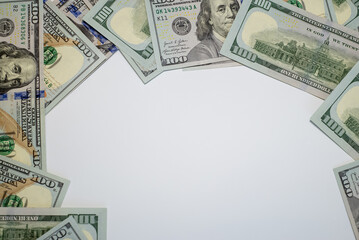 Stacks of hundred dollar bills arranged creatively on a flat surface for financial themes and marketing
