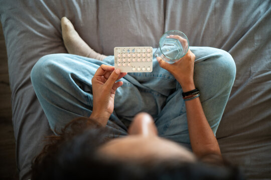 woman taking birth control pills