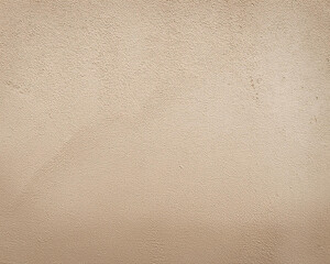 Colored background of an antique concrete wall texture. Close-up of the texture of a vintage, basic, cream-colored cement wall background.