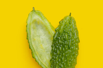 Bitter melon on yellow background.