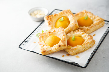 Apricot pastries with almond flakes