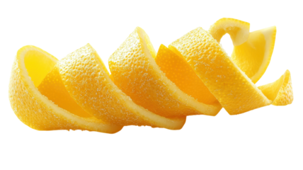 Slicing bright yellow lemon peels for a refreshing twist on culinary dishes