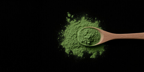 Matcha Powder and Spoon on black background: A wooden spoon rests atop a vibrant pile of matcha powder, presenting a rich green hue that hints at the healthy benefits and earthy notes.