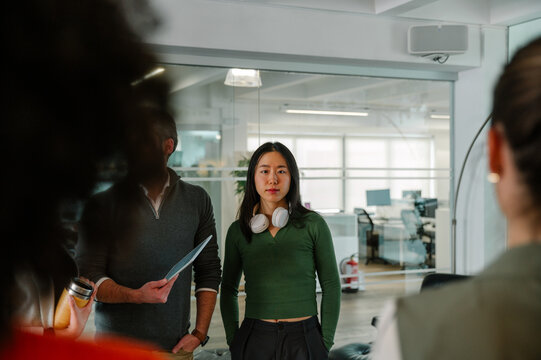 Team Discussion in Modern Office with Focused Young Professionals
