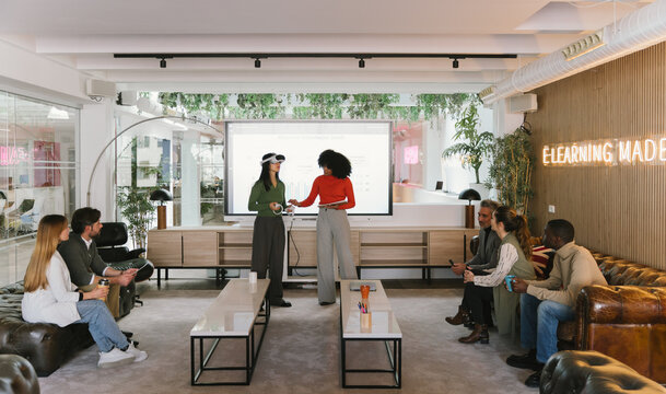 Interactive presentation in modern coworking office setting