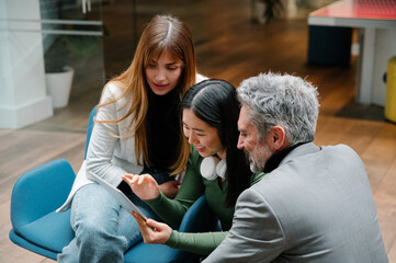 Collaborative team reviewing digital content on tablet