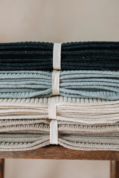 Neatly Folded Cozy Knitted Blankets Stacked