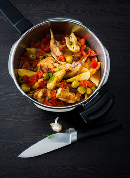 home cooked Rabbit stew with olives and vegetables in a steamer pot