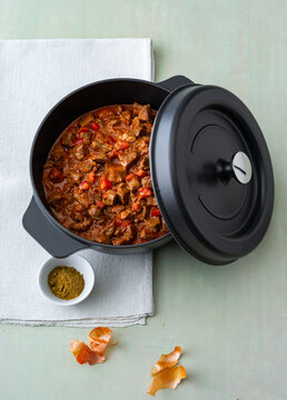 Hearty lamb Curry stew simmering in a pot with vegetables and spices