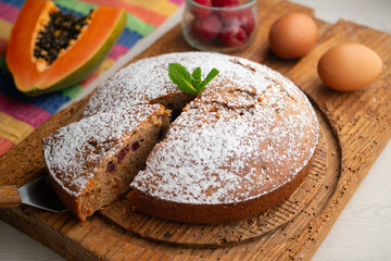 Delicious whole wheat vegan cake with papaya and nuts.