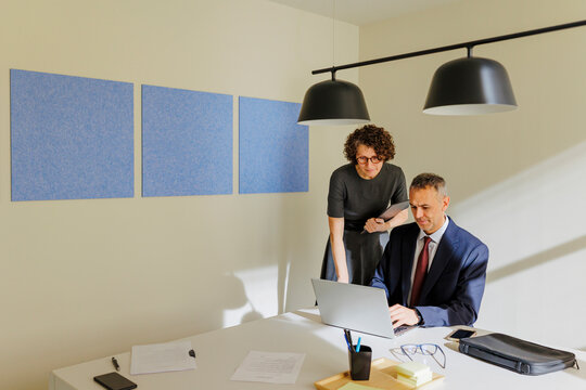 Business colleagues collaborating in modern office