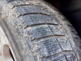 Nail in an old car tire