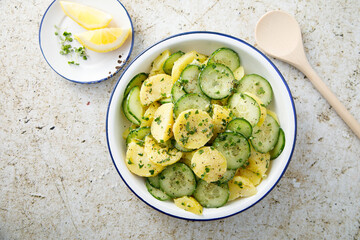 Homemade potato salad with cucumber and lemon