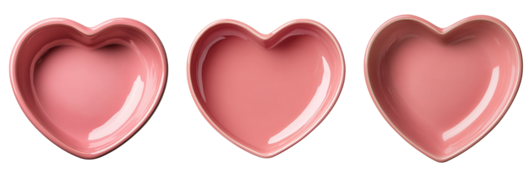 Three pink heart shaped ceramic bowls isolated on transparency background