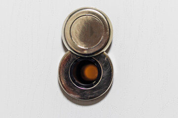 Close up shot of the door peephole. Concept
