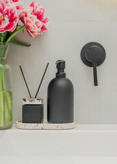 Elegant bathroom with floral accents and sleek black details