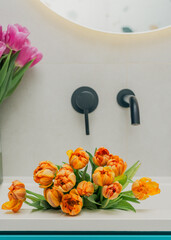 Elegant bathroom with floral accents and sleek black details