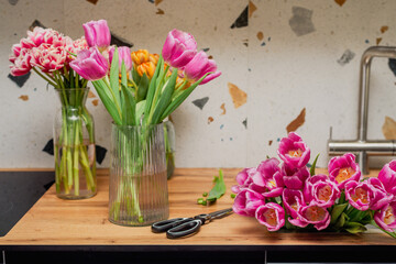 The process of caring for flowers. Trimming tulips