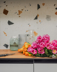 The process of caring for flowers. Trimming tulips