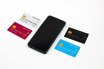 Fototapeta premium credit card and mobile phone isolated on white background.online payment concept