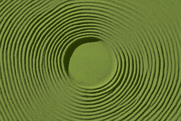 Obraz premium Abstract Spherical Ripples: A captivating visual of concentric circular patterns radiates from a central sphere, embodying the delicate interplay of energy and form in a textured green setting.