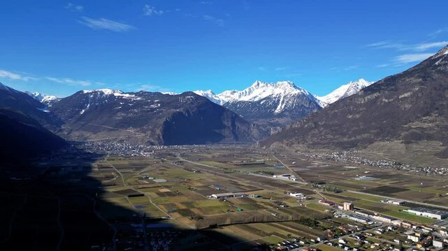 Panoramic View of Martigny and Charrat , with snow-capped mountains in the Swiss Alps