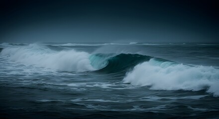 Fototapeta premium Dramatic deep blue ocean waves blurred by long exposure