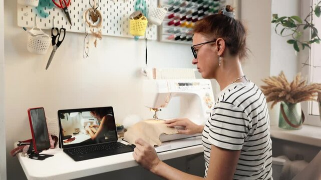 Interactive sewing lesson with detailed instructions on creating custom garments. Ideal for aspiring designers, diy enthusiasts, and creative entrepreneurs. Businesswoman writes notes in notebook.