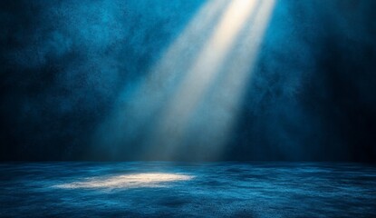 Spotlight illuminates textured stage floor, providing an empty background for presentations