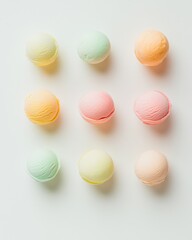 Colorful Pastel Ice Cream Scoops Arrangement on White Background, Top View