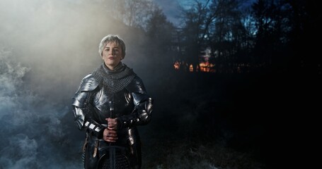 The Heroic Knight Stands Strong and Resolute Amidst a Mysterious Foggy Landscape