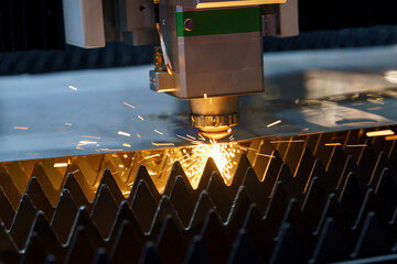 sparks when cutting metal, laser cutting of metal on a machine, automated metal cutting