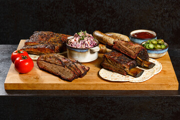 BBQ platter with smoked brisket, ribs, sausages, coleslaw, pickles, and sauce on a wooden board. Hearty, rustic, and flavorful grilled feast.