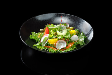 A fresh and vibrant vegetable salad, elegantly plated in a restaurant-style presentation. A mix of crisp vegetables, bright colors, and a light dressing