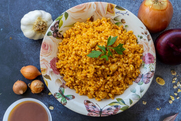Traditional Turkish bulgur pilaf in a plate (Turkish name; Chickpea bulgur pilaf)