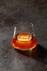 glass of alcohol coctail on dark background