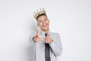 Handsome man wearing luxury crown on white background