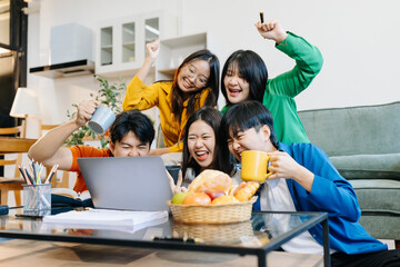 Happy group of college students excited overjoyed examination results with good news over smartphone or Laptop computer.