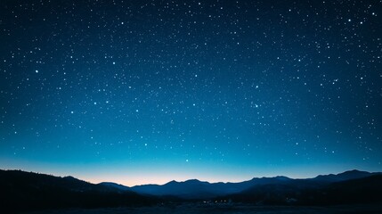 Fototapeta premium A vast starry night sky with thousands of twinkling stars above a landscape, inspiring wonder and reflection on our place in the universe.