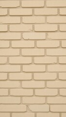 Fototapeta premium A brick wall with a smooth textured beige stone patterned background is used as a backdrop